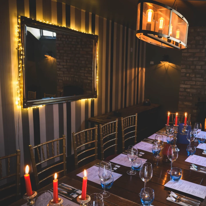 Corporate Event Space At The Albion Bristol With Long Dining Table Gold Chiavari Chairs Candlelight And Screen Corporate Hire Clifton Village