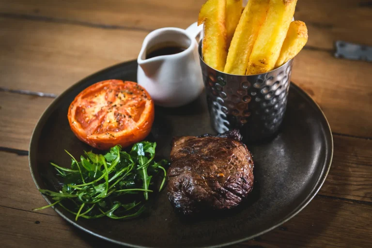 Grilled Steak With Fries Roasted Tomato Rocket And Sauce Served At The Albion Pub Bristol Clifton Village Steak Night